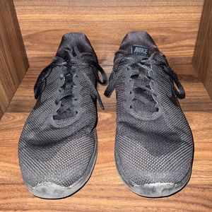 Black Nike tennis shoes